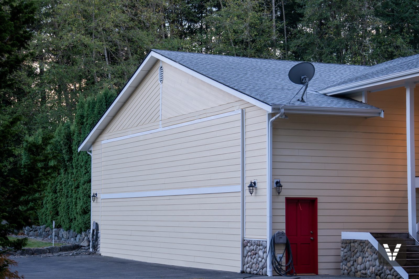 Hangar gable with the main house beyond — Siding & Window Vault project in Lake Stevens, WA